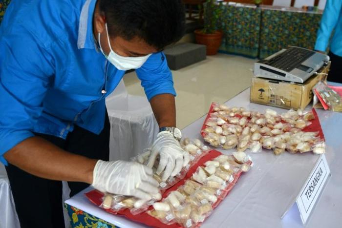 Some 99 plastic baggies filled with white powder that Asman had swallowed, were found, authorities said