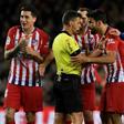 Atletico Madrid's Spanish forward Diego Costa confronts referee Gil Manzano during the Spanish league match against Barcelona