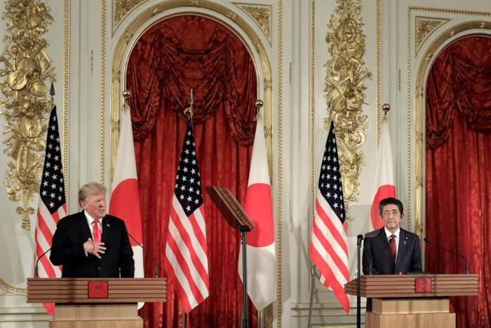 President Donald Trump and Prime Minister Shinzo Abe emphasised their friendship in Tokyo - part of Japan's strategy to deal with the rule-breaking US leader