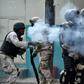 Haitian police shoot tear gas during clashes in central Port-au-Prince on February 12, 2019 during protests against Haitian President Jovenel Moise