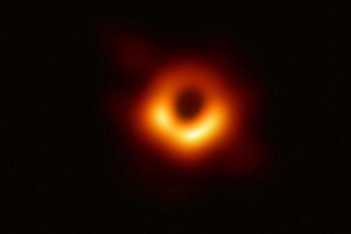An image provided by the European Southern Observatory on April 10, 2019 shows the first picture of a black hole and its fiery halo, released by Event Horizon Telescope astronomers (EHT)