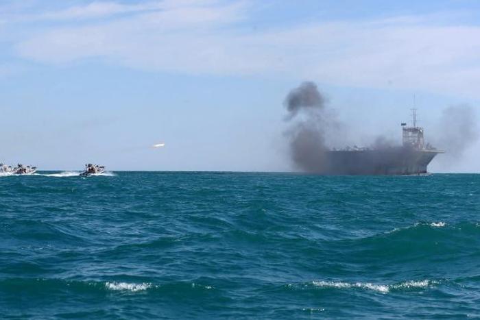 Iran's elite Revolutionary Guard attacks a vessel during a previous drill in the Strait of Hormuz in 2015