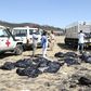 Rescue teams collect bodies at the crash site of an Ethiopia Airlines plane which came down near the capital Addis Ababa, killing all 157 on board