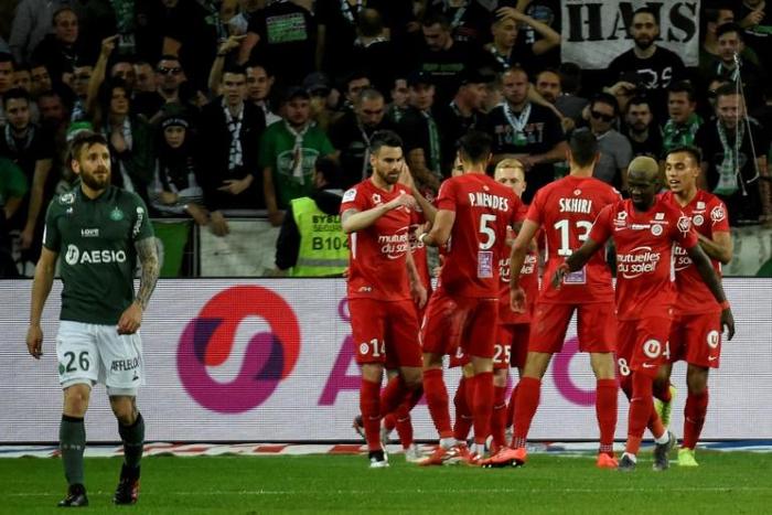 Montpellier's players celebrate going ahead at Saint-Etienne