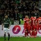 Montpellier's players celebrate going ahead at Saint-Etienne
