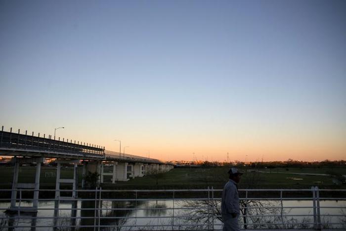 A man walks near the International bridge on the US/Mexico border in 2017 in Piedras Negras, where the group of around 1,700 mainly Hondurans arrived