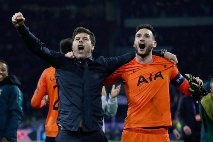 Tottenham manager Mauricio Pochettino celebrates with Hugo Lloris after their stunning win at Ajax