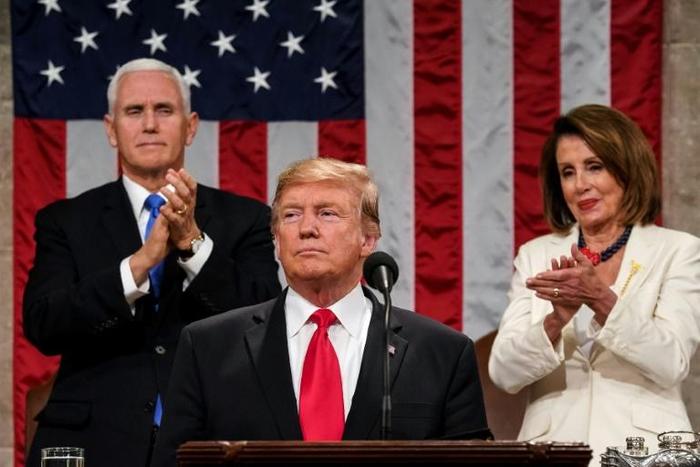 US President Donald Trump delivers the State of the Union address in the US Capitol, with Vice President Mike Pence and Speaker of the House Nancy Pelosi behind him