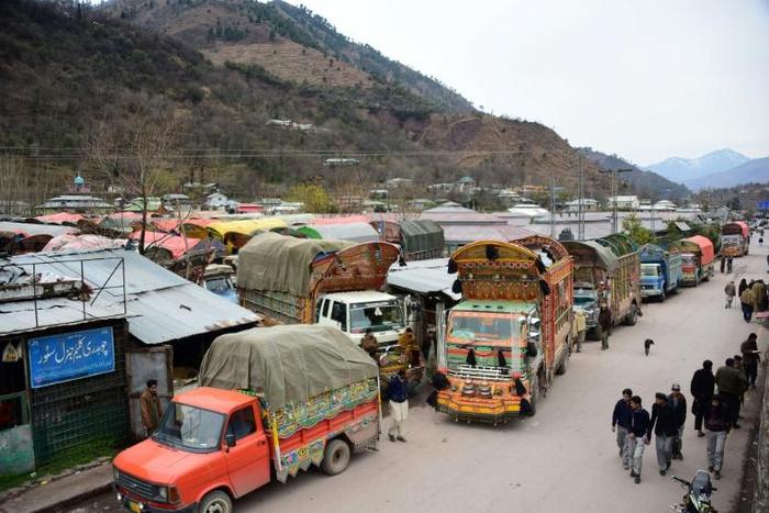 Trucks jam the road in border town of Chakothi in Pakistan-administered Kashmir, where bunkers are being rebuilt and a blackout ordered since a deadly attack sent tensions with neighbouring India soaring