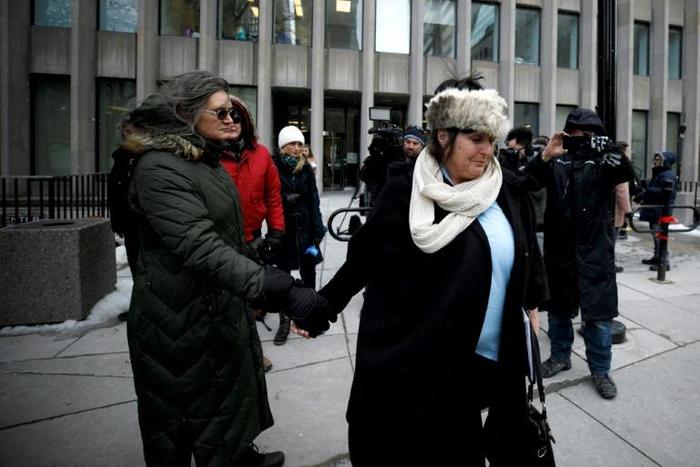 Shelly Kinsman (R) leaves the Toronto courthouse in Toronto, Bruce McArthur was sentenced for killing her brother Andrew Kinsman and seven other men