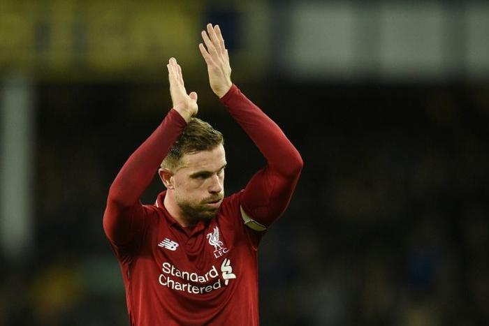 Liverpool midfielder Jordan Henderson applauds the fans after his side drew with Everton at Goodison Park