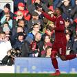 Pointing the way: Georginio Wijnaldum celebrated after Liverpool's second goal in the Premier League leaders' 3-0 win over Bournemouth at Anfield