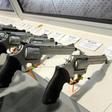 Handguns are displayed at the Taurus International Firearms booth at a gun show in 2011 in Las Vegas