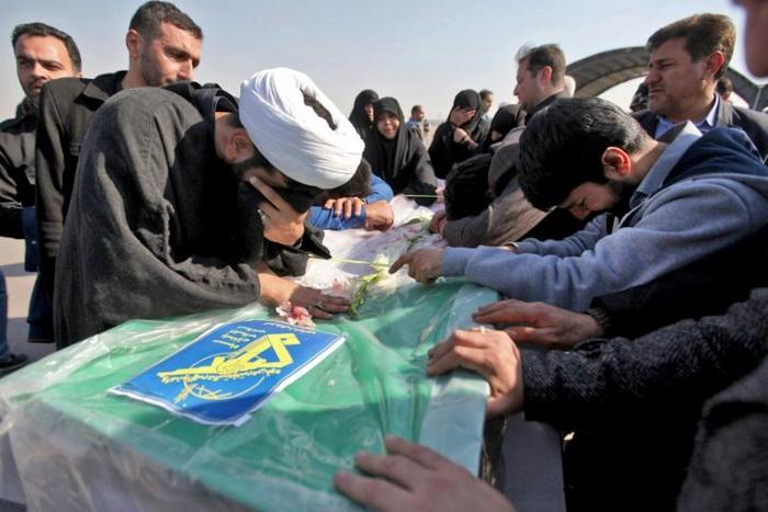 Iranians mourn victims of a suicide bombing on a Revolutionary Guards bus in southeastern Iran, as the coffins arrive at Badr airport in Isfahan, some 400 kilometres south of the capital Tehran on February 14, 2019