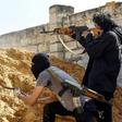 Pro-government forces are battling fighters from commander Khalifa Haftar's self-styled Libyan National Army
