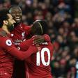 Guinean Naby Keita (C) celebrates his goal for Liverpool against Huddersfield Town with Egyptian Mohamed Salah (L) and Senegalese Sadio Mane.