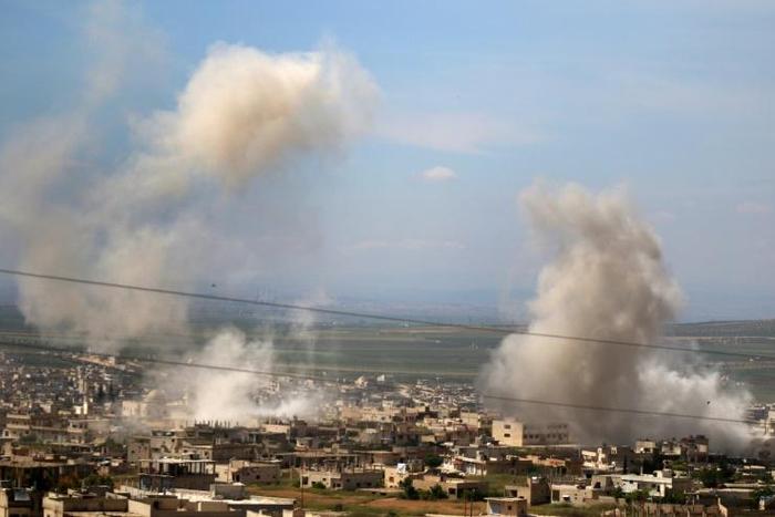 Smoke billows following shelling in Khan Sheykun in Syria's jihadist-held Idlib province on May 10, 2019. Syrian government forces and their Russian allies have stepped up bombardment of the jihadist bastion since late April