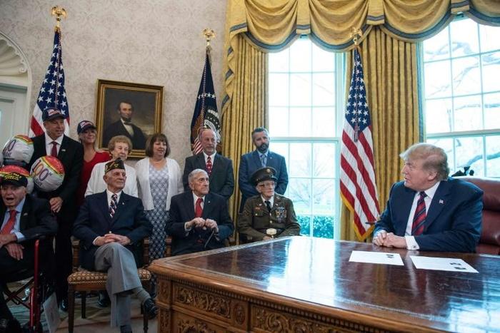 US President Donald Trump says he'll be attending Normandy 75th anniversary ceremonies at a meeting with WWII veterans and their families in the Oval Office
