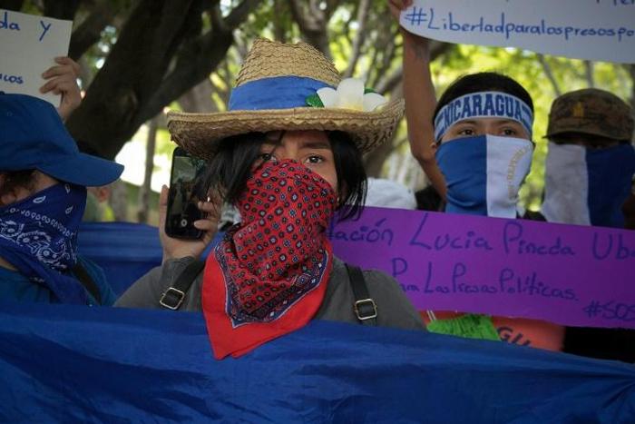 Nicaraguan students take part in a demonstration to mark 11 months since the beginning of anti-government protests, and to demand the release of political prisoners, in Managua on March 18, 2019