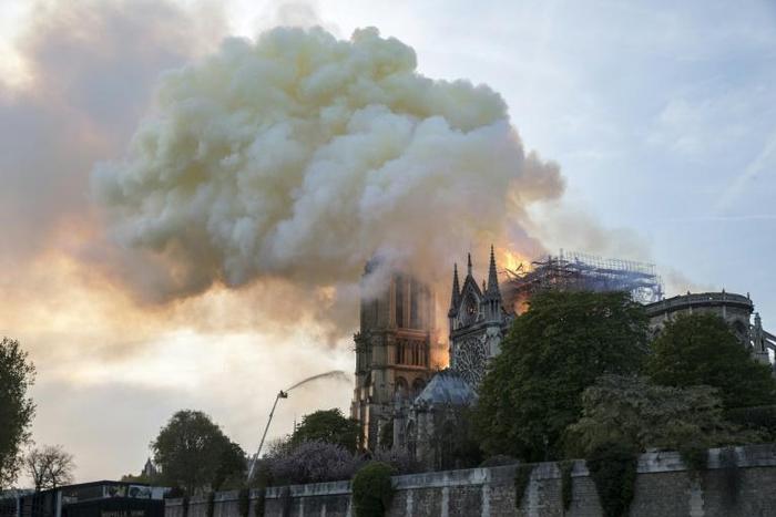 The Notre-Dame blaze, which brought the iconic cathedral's towering spire and roof crashing down, is being treated by French investigators as an "involuntary fire"