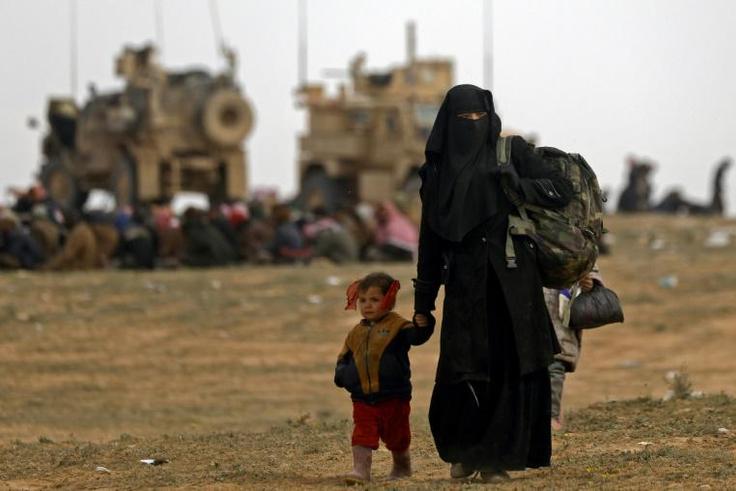 Civilians flee the Islamic State's group crumbling last holdout of Baghouz in eastern Syria