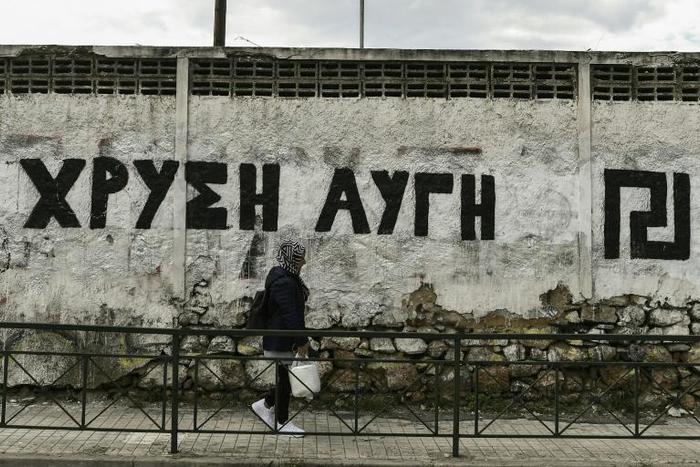 In Athens a wall is painted with the logo of neo-Nazi party Golden Dawn whose four-year-long trial could be nearing conclusion
