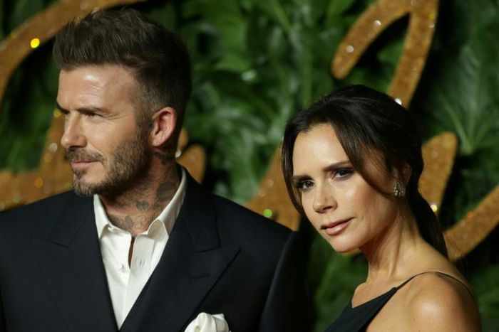 Former English football star David Beckham with wife Victoria