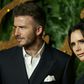 Former English football star David Beckham with wife Victoria
