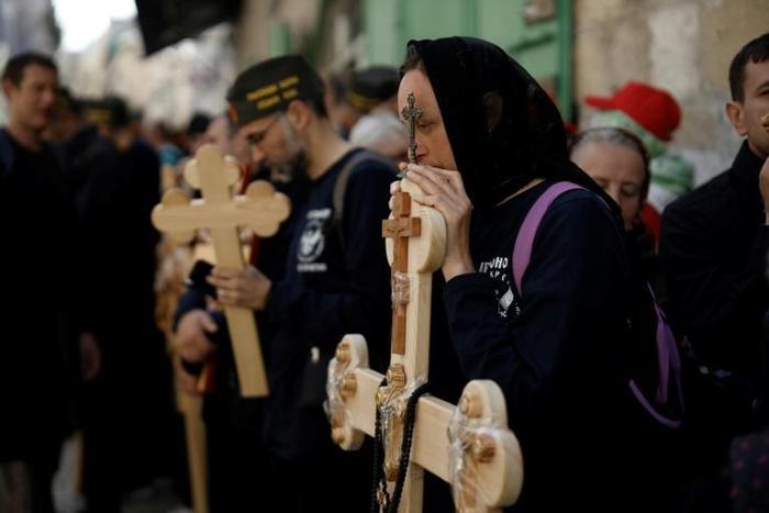 Orthodox Christians mark Good Friday in a procession along the Via Dolorosa in the Old City of Jerusalem, on April 26, 2019