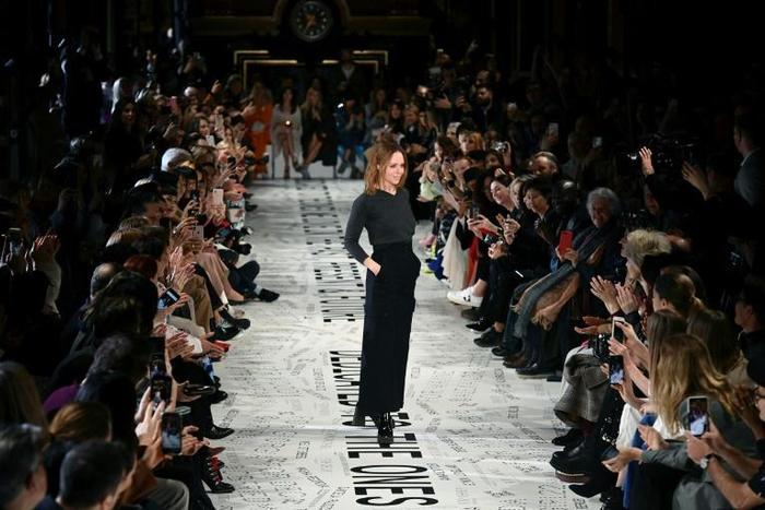 British fashion designer Stella McCartney acknowledges the applause at the end of her Paris fashion week show