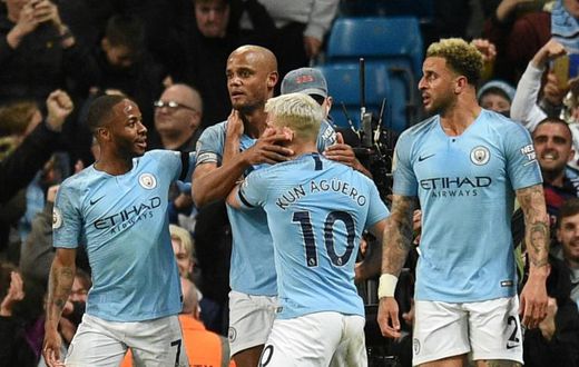 Kompany man: Manchester City captain Vincent Kompany celebrates his goal against Leicester