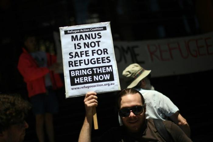 A refugee advocate protests against asylum-seeker camps in Sydney. The issue has long been a political football in the country