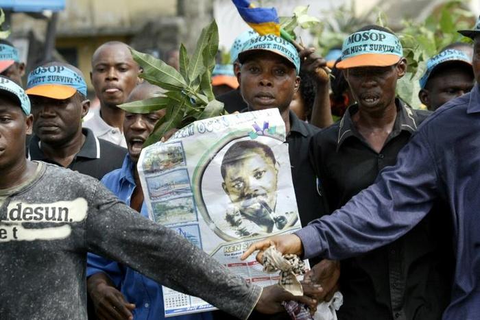 Members of the Ogoni community carrying a poster of Ken Saro-Wiwa marched in Port Harcourt to remember the civil rights activist on the 10th anniversary of his 1995 execution