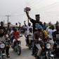 US-Nigerian musician Olubankole Wellington, popularly known as Banky W., rode with supporters in a line of motorcycles during a campaign rally in Lagos