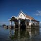 Twenty years ago the residents of Sitio Pariahan could walk to the local chapel but today reaching it requires a swim, because the town, like many in the Philippines, is sinking