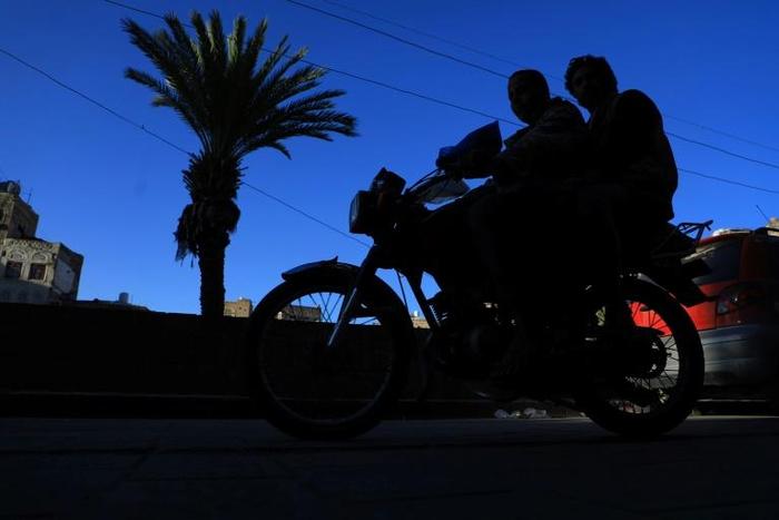 Motorcyclists ride in November 2018 through Yemen's capital Sanaa, where the Baha'i community says one of its members faces an appeal of a death sentence