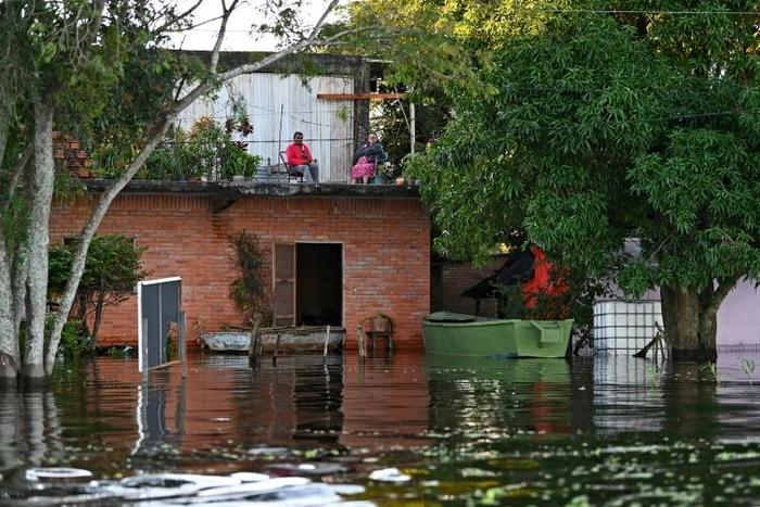 Some residents living close to the Paraguay River have had to move into the upper floors of their homes to escape the rising floodwaters