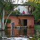 Some residents living close to the Paraguay River have had to move into the upper floors of their homes to escape the rising floodwaters