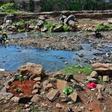 Rock arrangements mark the ground where authorities say bodies, mostly babies, were recovered from Nairobi's rivers