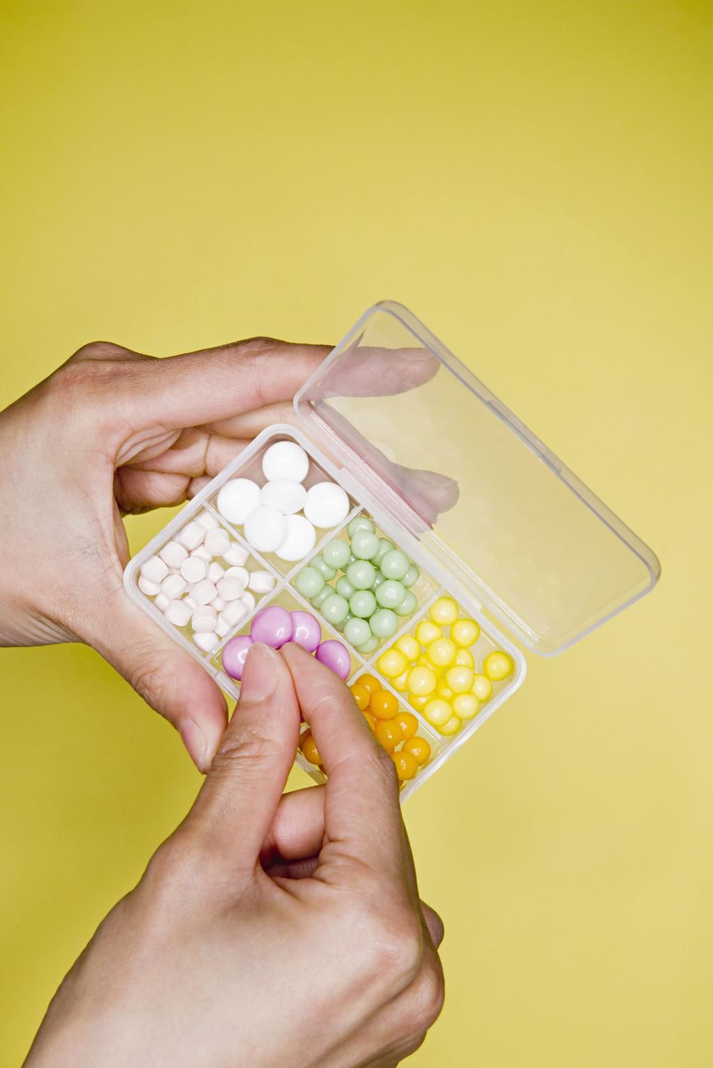 Person with box of tablets