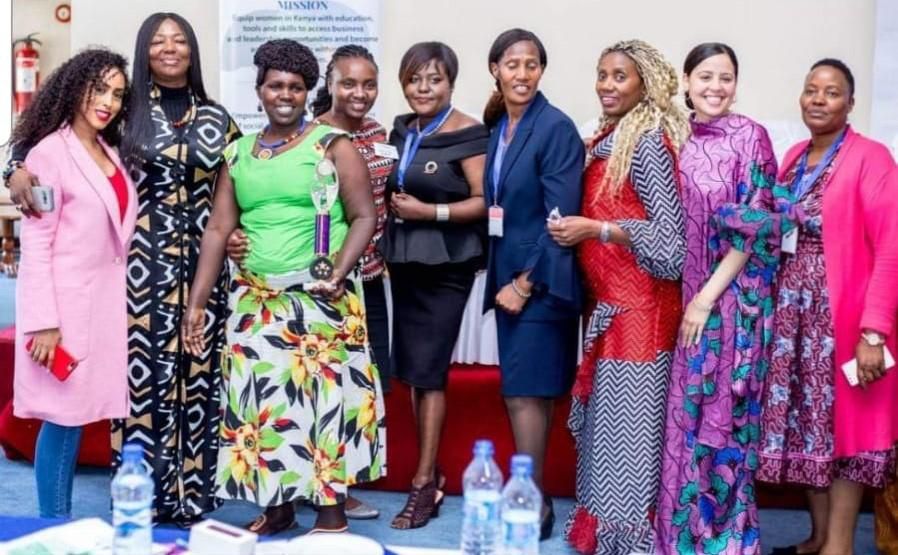 CWR members celebrate Teresia Mwangie's award at the 2018 Kenya Conference