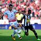 Mohamed Nahiri (L) of Wydad Casablanca shields the ball from Rainford Kalaba of TP Mazembe. Both clubs will be in CAF Champions League quarter-finals action Saturday. 