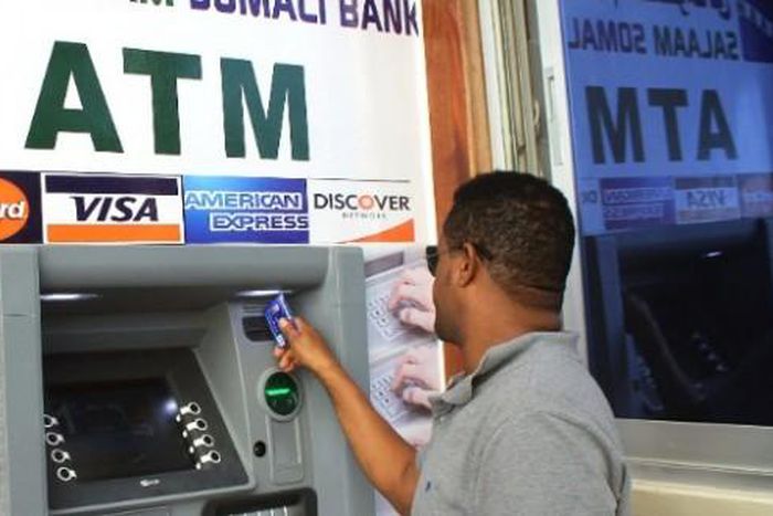 Man withdrawing money from the ATM
