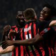 Fabio Borini (C) celebrates with Tiemoue Bakayoko (L) and Ivorian midfielder Franck Kessie after scoring at the San Siro