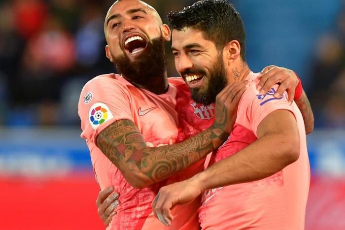 Luis Suarez (right) scored a penalty as Barcelona beat Alaves 2-0 on Tuesday in La Liga