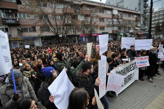 Angry protestors in the Kosovo capital Pristina demand justice for a teenager who said she was raped by her teacher and then a police officer