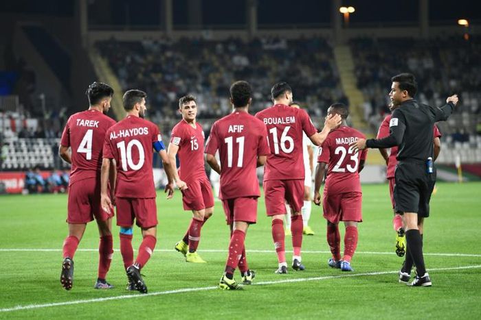 Qatari players celebrate a goal during the 2019 AFC Asian Cup Round of 16 against Iraq at the Al Nahyan Stadium in Abu Dhabi on January 22, 2019