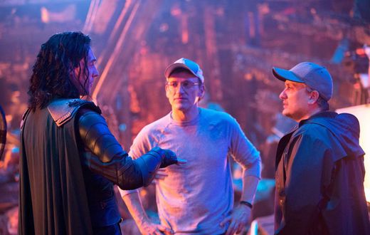 The Russo Brothers (Joe and Anthony Russo) alongside Tom Hiddleston on the set of Avengers: Infinity War.