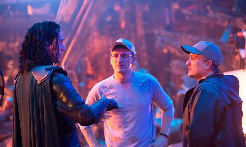 The Russo Brothers (Joe and Anthony Russo) alongside Tom Hiddleston on the set of Avengers: Infinity War.