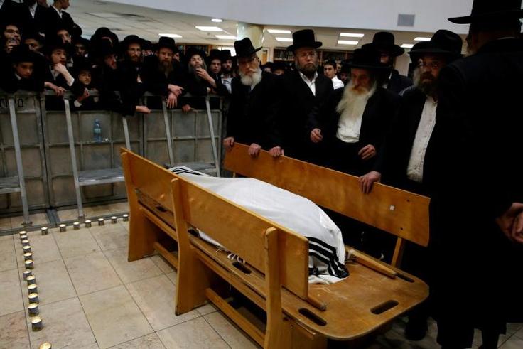 Ultra orthodox Jewish men attend the funeral of Hassidic Rabbi Menahem Mendel Taub, who died at the age of 96, in Jerusalem on April 28, 2019. Thousands attended the funeral for the revered Israeli rabbi and Holocaust survivor known for his especially ...